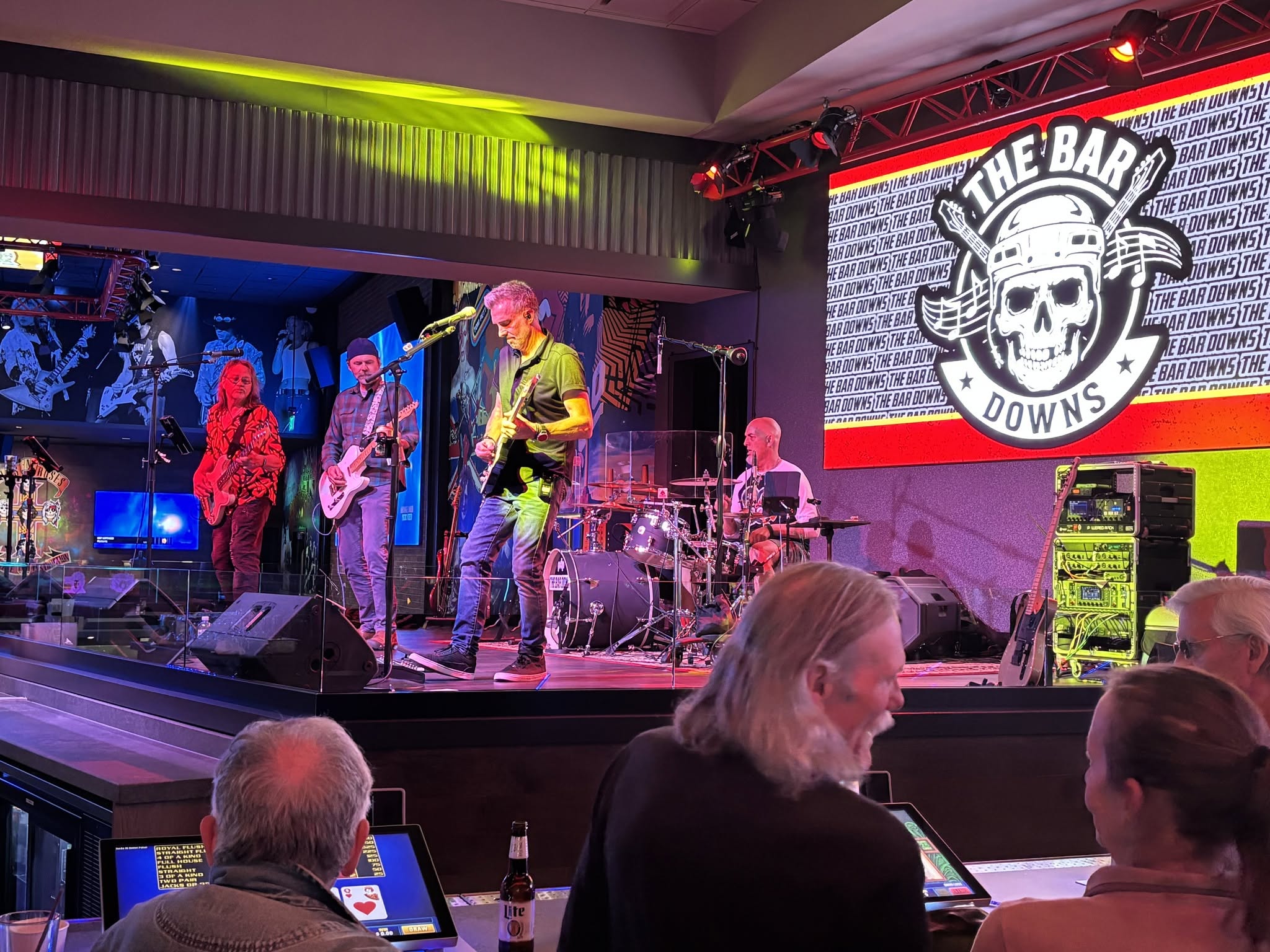 The Bar Downs on stage beside the band logo